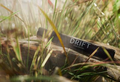 Drift sublingual cannabis spray bottle on grass